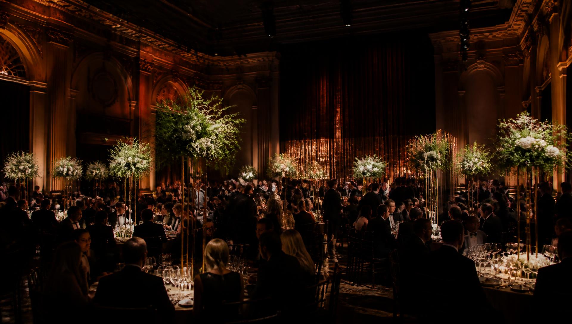 Grand ballroom celebration lit by warm amber light